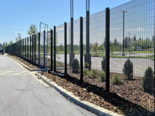 Black welded mesh security fence along the site landscaping, Ambleside Integrated Site