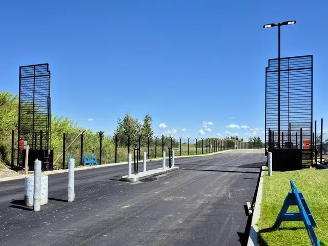 Cantilever slide gate in a welded mesh security perimeter, Ambleside Integrated Site
