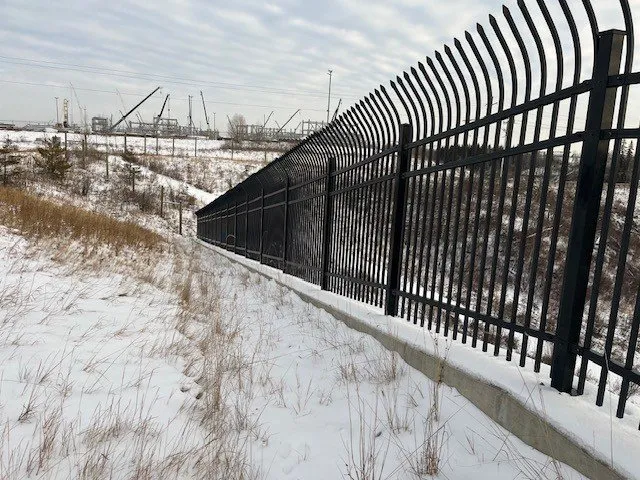 Black ornamental security fence with curved pickets, Aurum Road