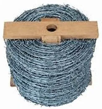 Roll of galvanized double strand barbed wire on a wood spool