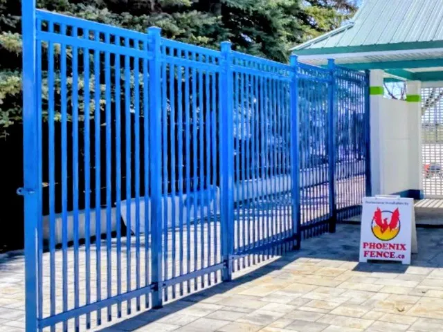 Blue ornamental fence and gate at the park entrance, Calaway Park