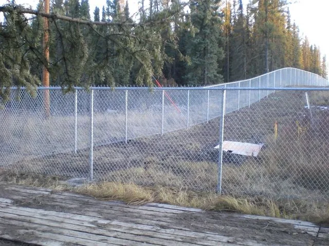 Galvanized industrial fence, northern Alberta