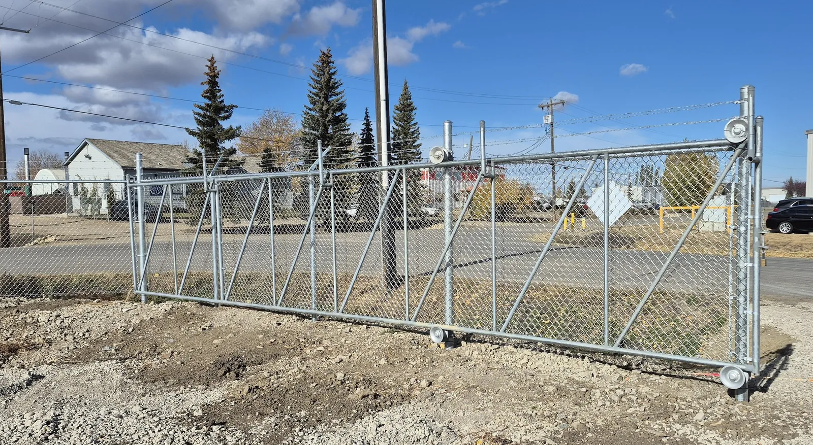 Galvanized rolo sliding chain link gate on a commercial site