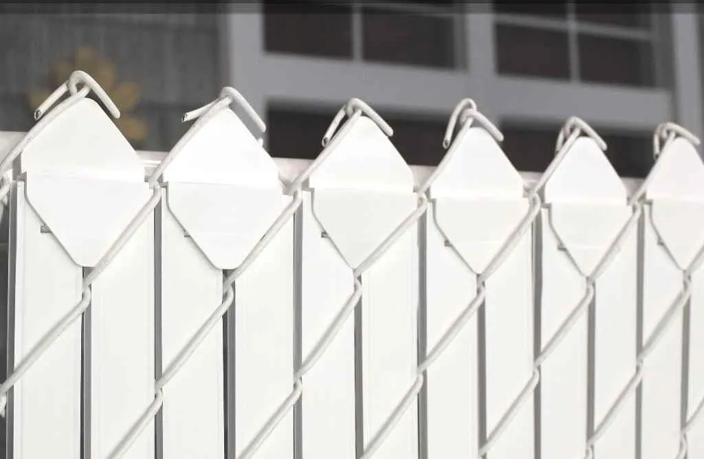 White Diamond Lock II privacy slats woven into chain link fence