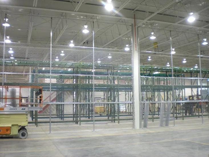Floor to ceiling chain link interior partitions in a warehouse