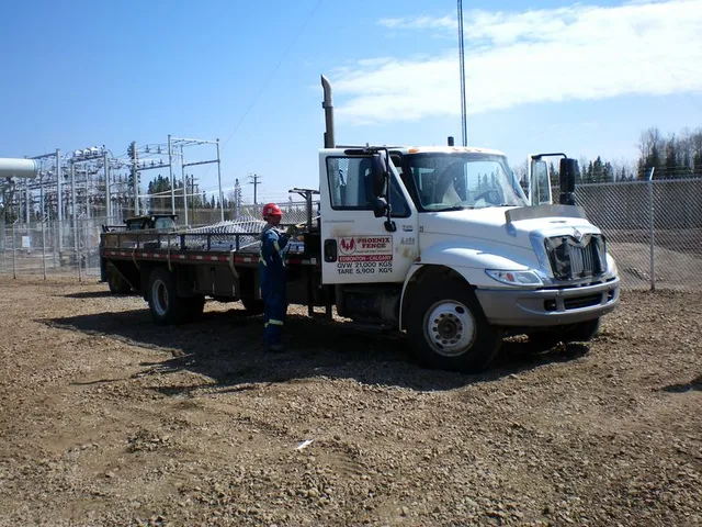 Phoenix Fence crew at an industrial site