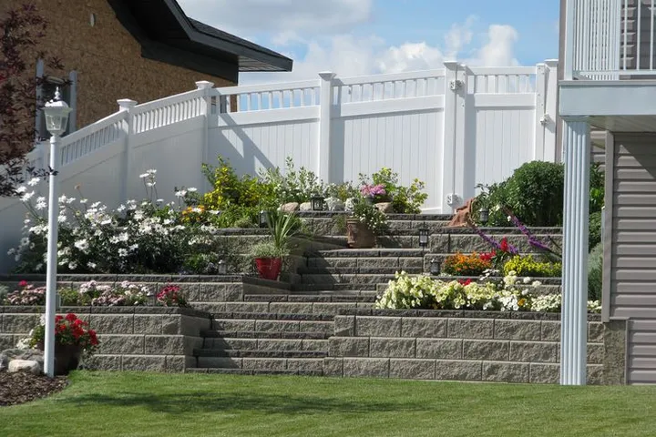 White vinyl privacy fence around a residential yard