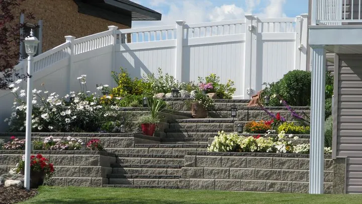 White vinyl privacy fence around a residential yard